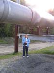 Stacey next to pipeline